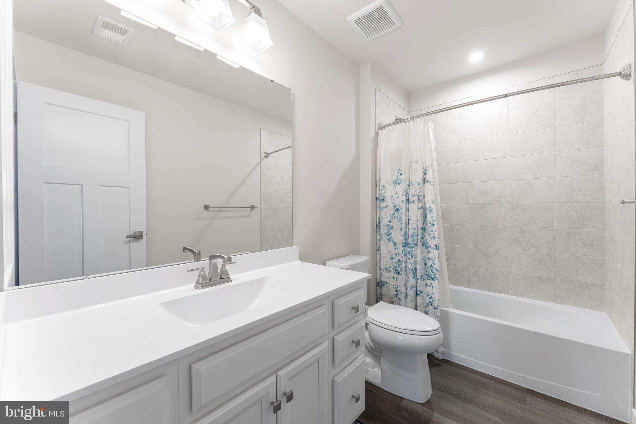 8003 Trimbles Ford Lane Brandywine, MD 20613 - Photo 31 of 70 a bathroom with a sink toilet and shower