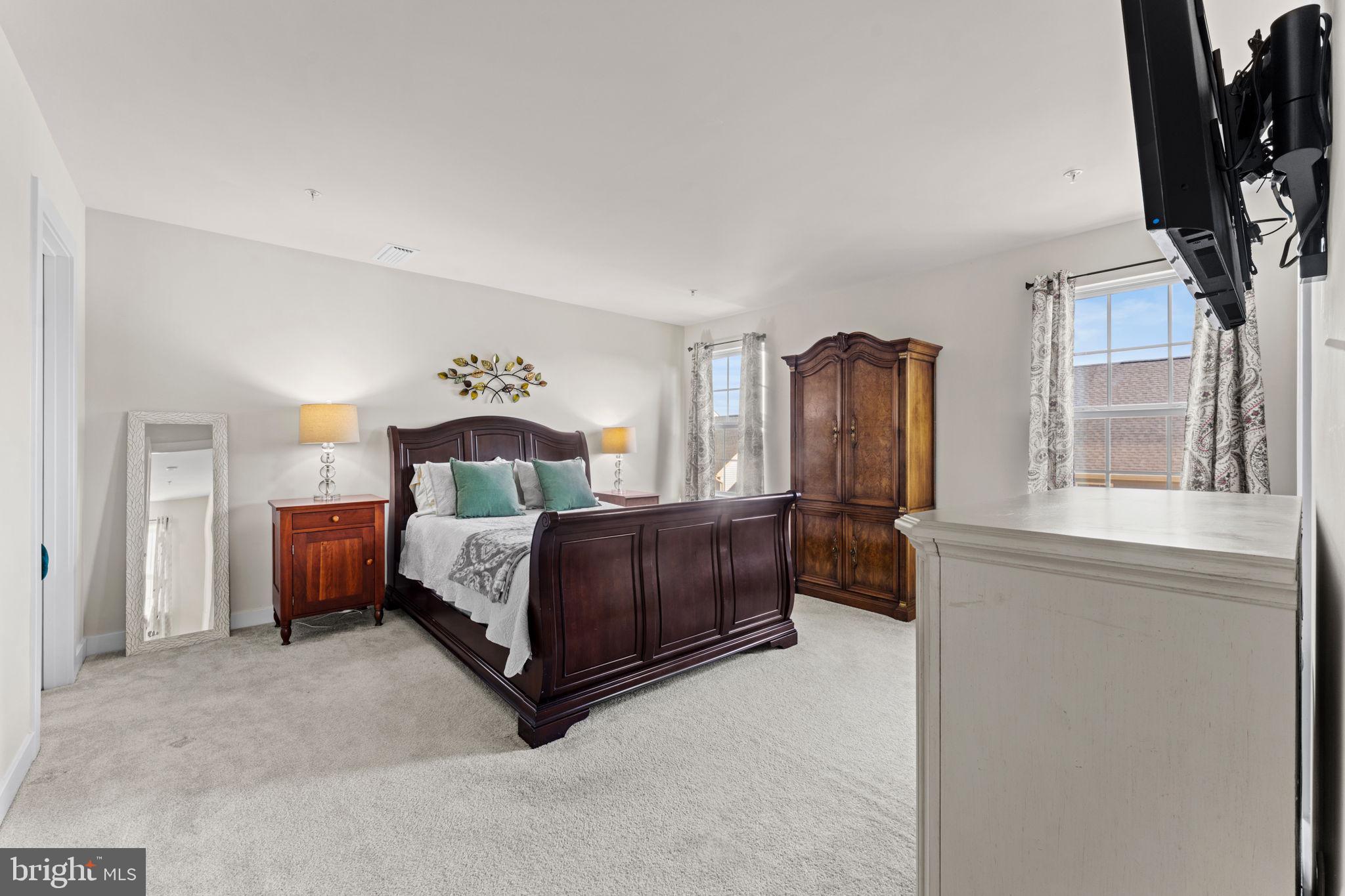8003 Trimbles Ford Lane Brandywine, MD 20613 - Photo 32 of 70 a spacious bedroom with a bed and a flat tv screen on dresser