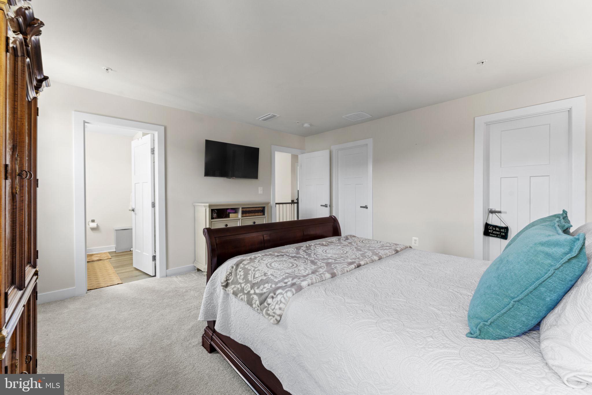 8003 Trimbles Ford Lane Brandywine, MD 20613 - Photo 34 of 70 a bedroom with a bed and a flat screen tv