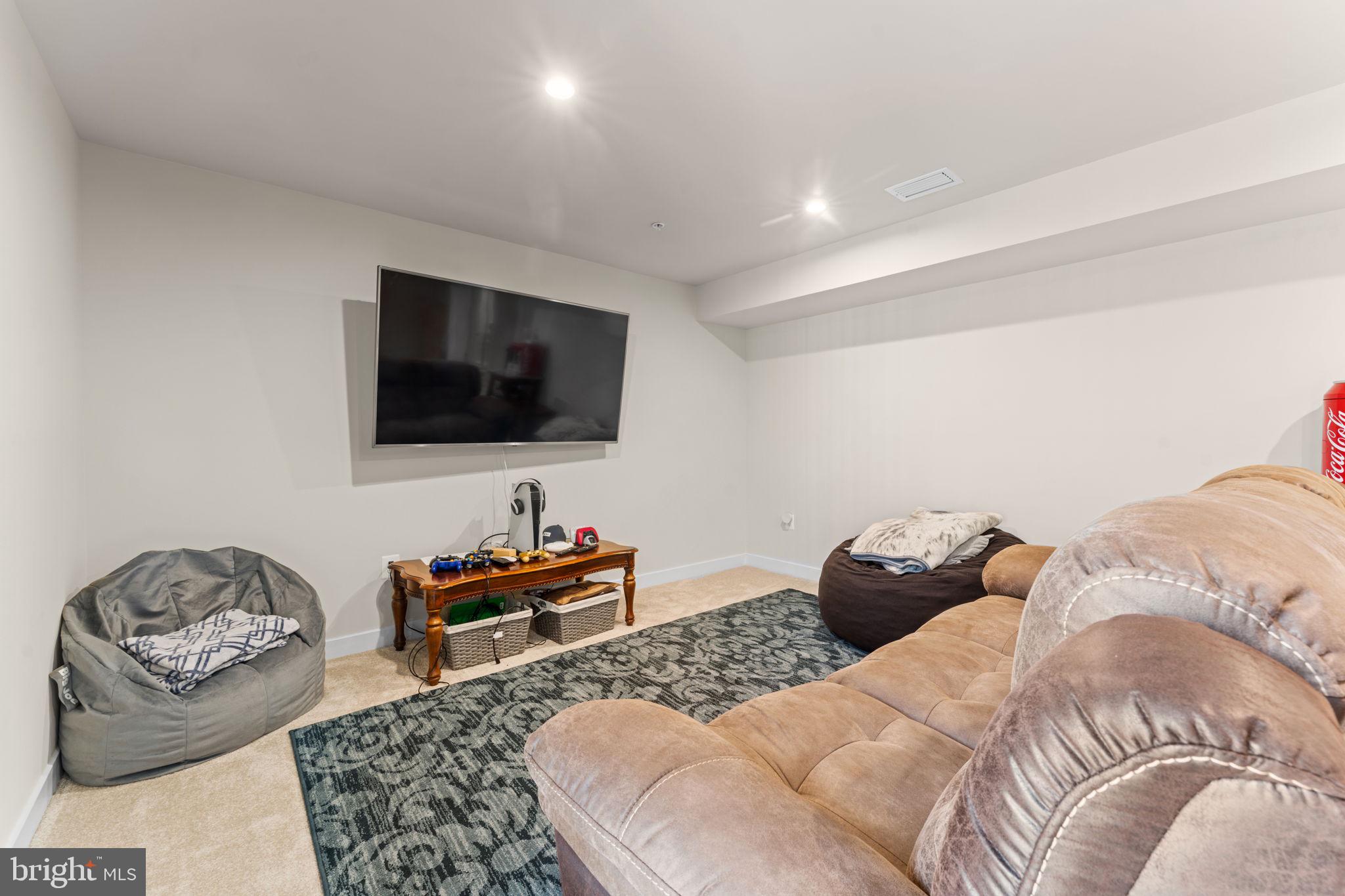 8003 Trimbles Ford Lane Brandywine, MD 20613 - Photo 42 of 70 a living room with furniture and a flat screen tv