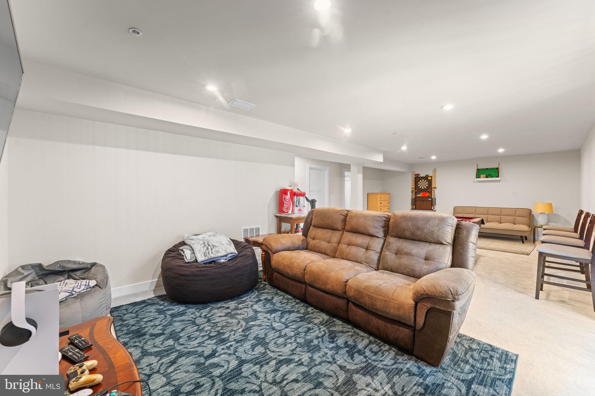 8003 Trimbles Ford Lane Brandywine, MD 20613 - Photo 43 of 70 a living room with furniture a rug and a chandelier