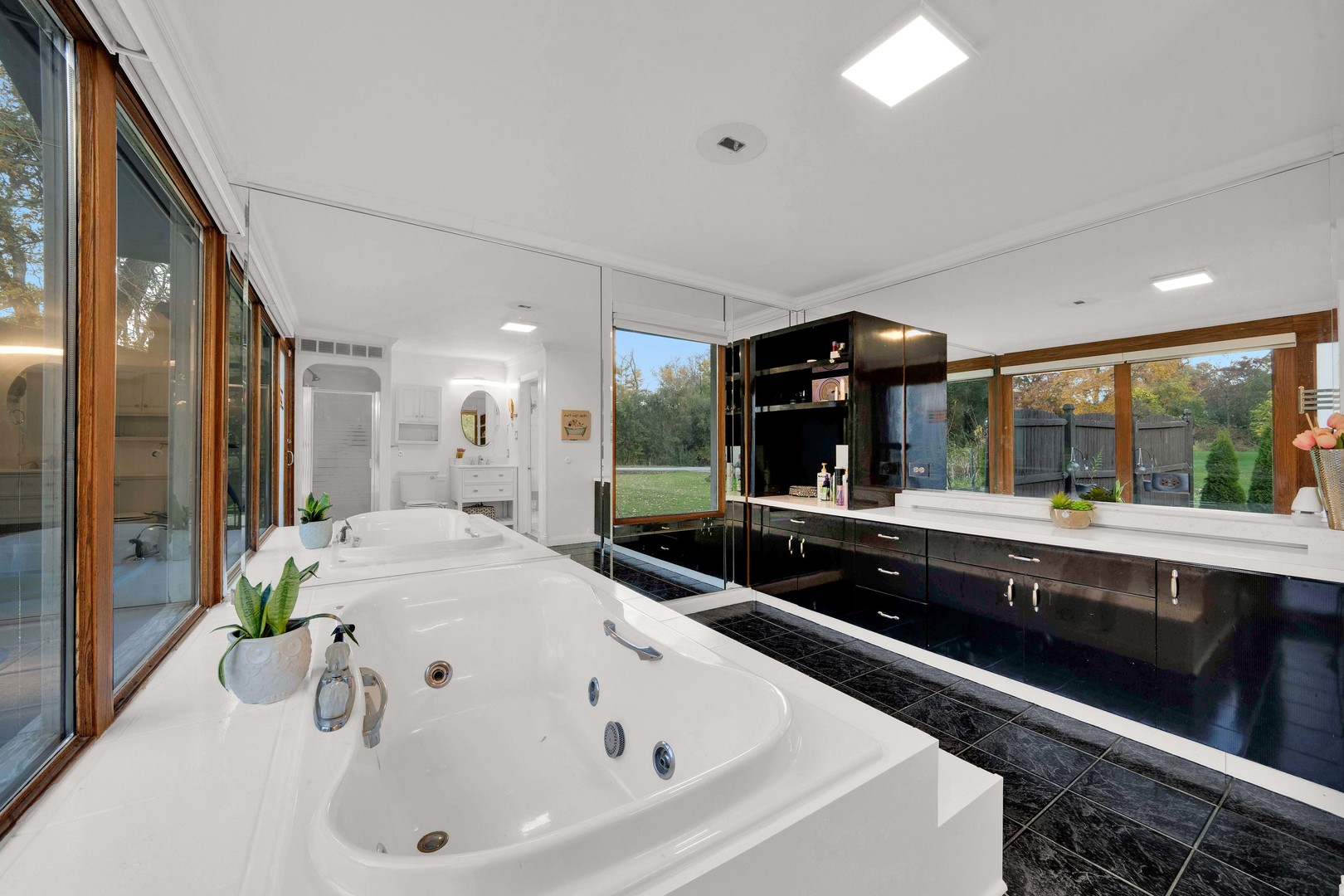 2135 West Richton Road Steger, IL 60475 - Photo 15 of 35 a large white kitchen with a large window and stainless steel appliances