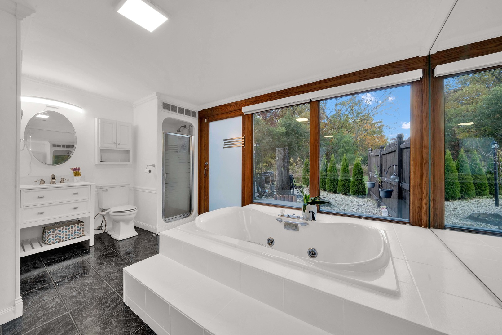 2135 West Richton Road Steger, IL 60475 - Photo 16 of 35 a bathroom with a sink and a large mirror