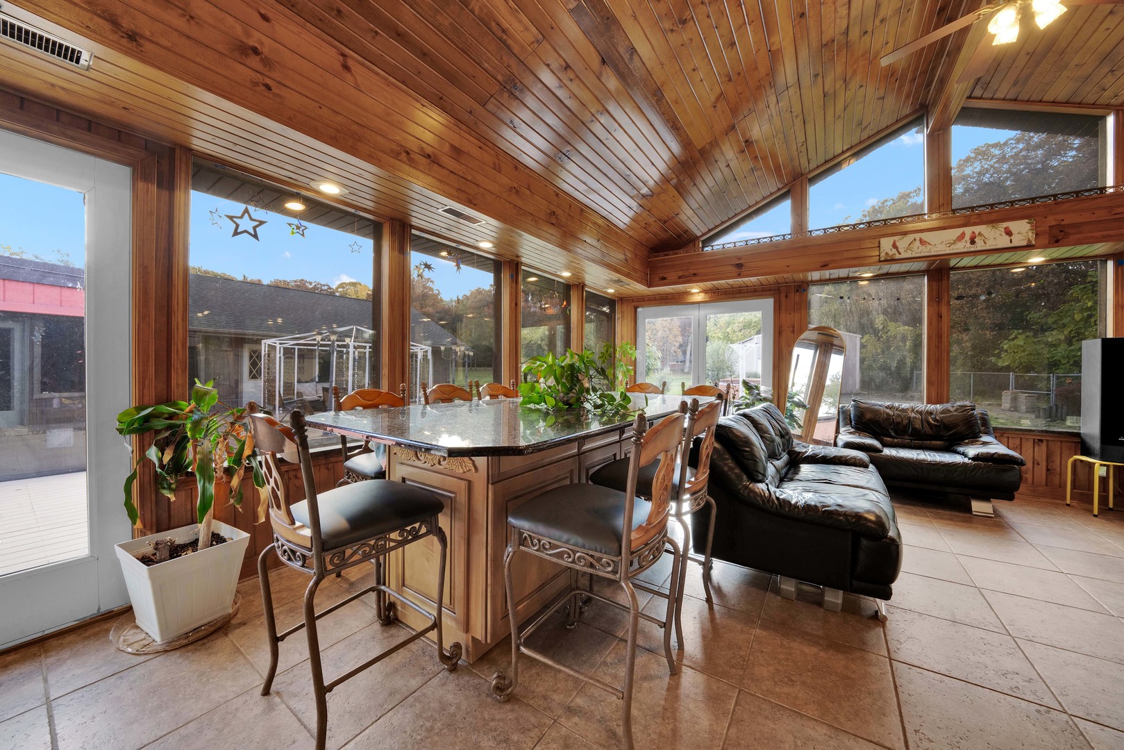2135 West Richton Road Steger, IL 60475 - Photo 19 of 35 a living room with patio furniture and a potted plant