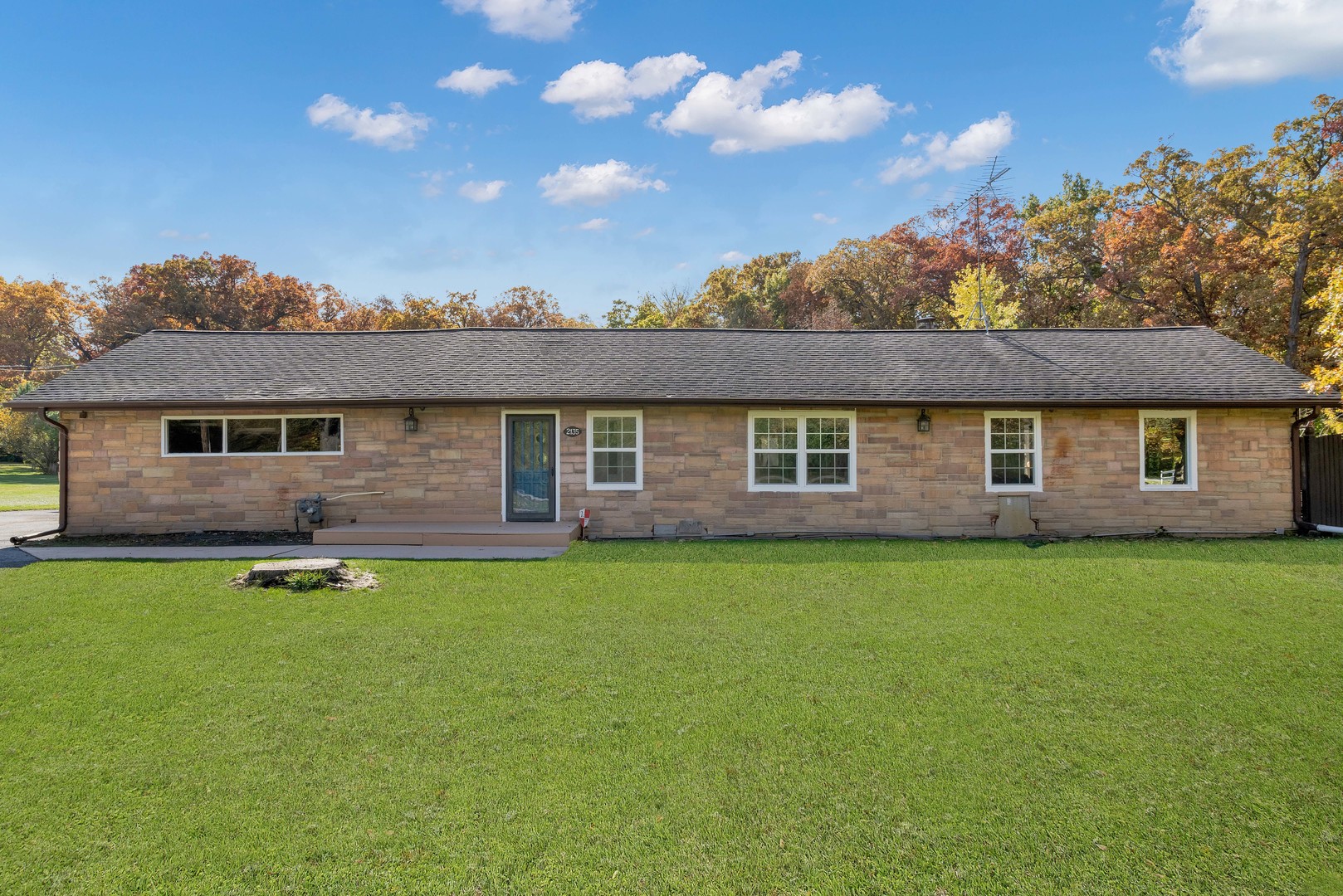 2135 West Richton Road Steger, IL 60475 - Photo 2 of 35 a front view of a house with a garden