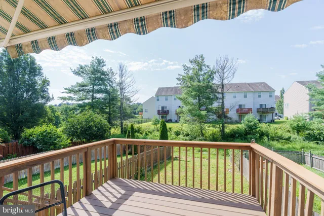a balcony with view of trees in front of it