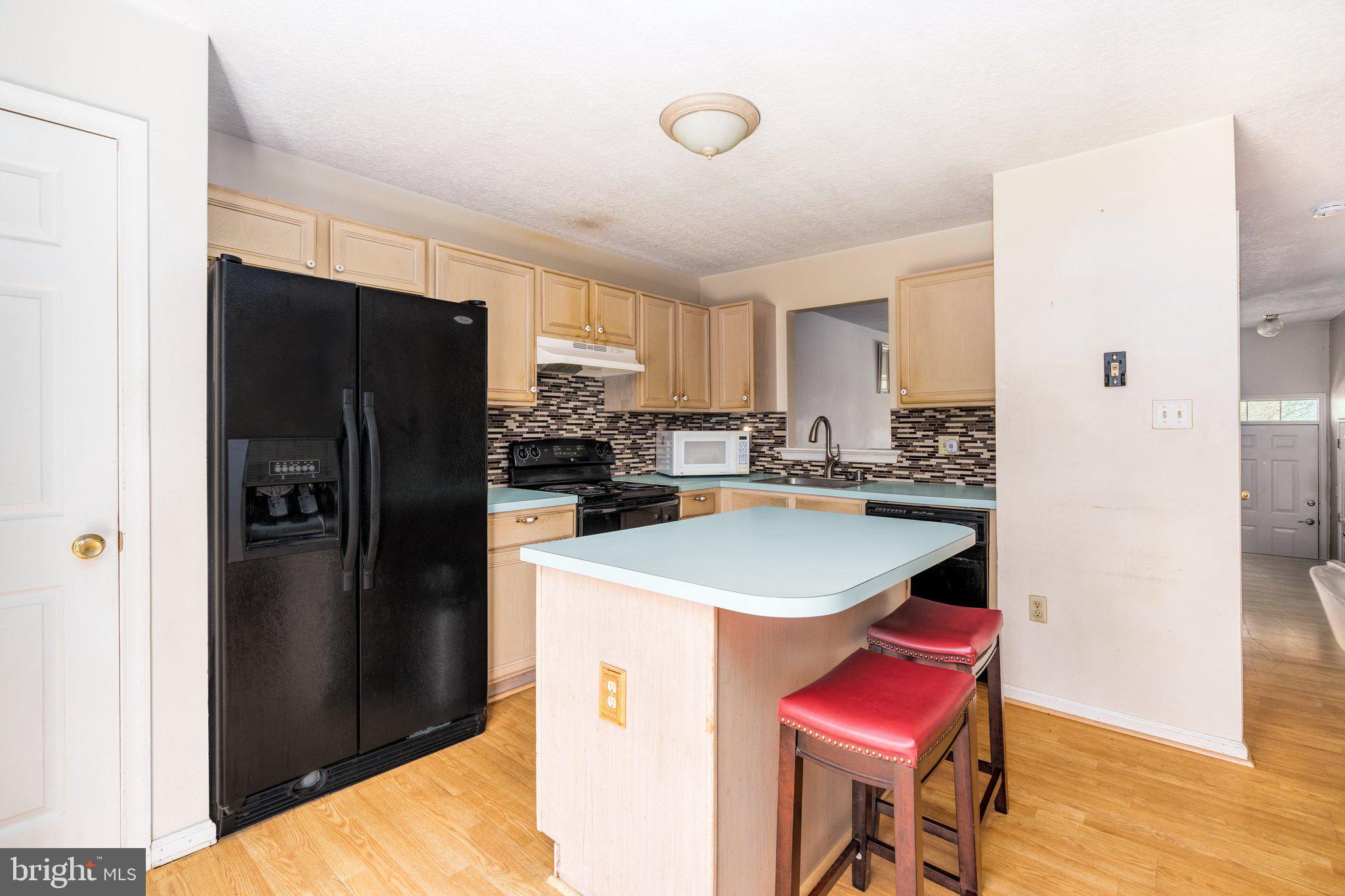 22 Buttonbush Court Elkton, MD 21921 - Photo 5 of 13 a kitchen with a refrigerator a stove a sink and cabinets