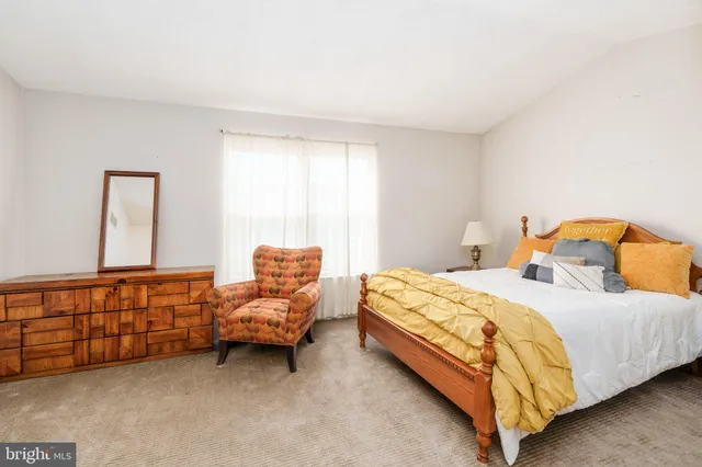 a bedroom with two beds and a couch