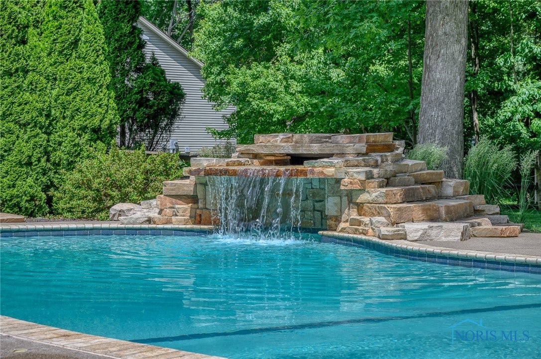 7126 Ramblehurst Road Sylvania, OH 43560 - Photo 30 of 33 Pool with grotto waterfall