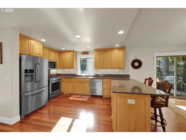 a kitchen with refrigerator cabinets and a table