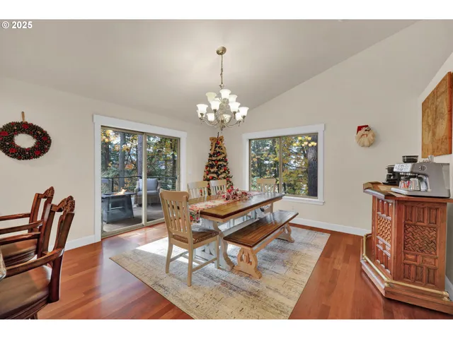 a living room with furniture a window and a dining table