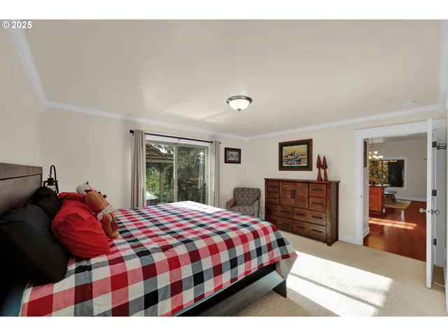 a bed room with a bed and a chair