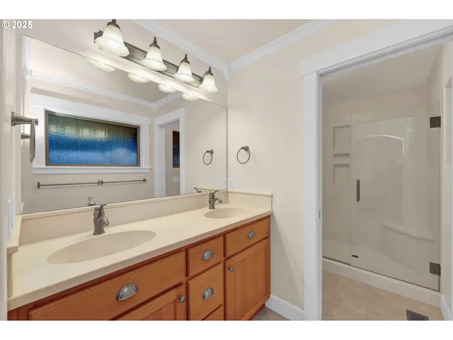 a living room with furniture and hard wood flooring