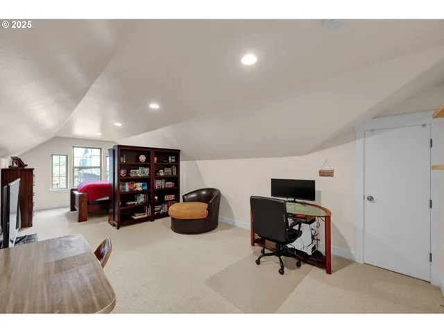 a bedroom with a bed and a table