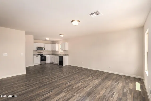 a view of kitchen with wooden floor