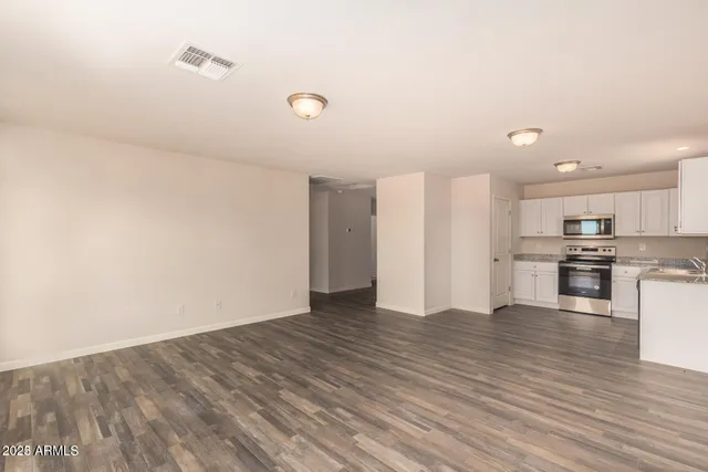 a view of kitchen with wooden floor