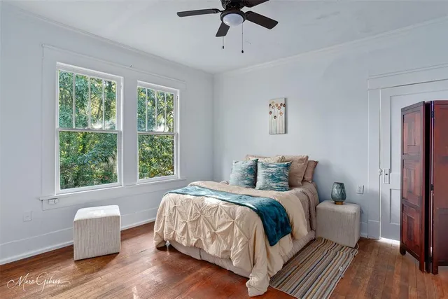 a bedroom with bed and a window