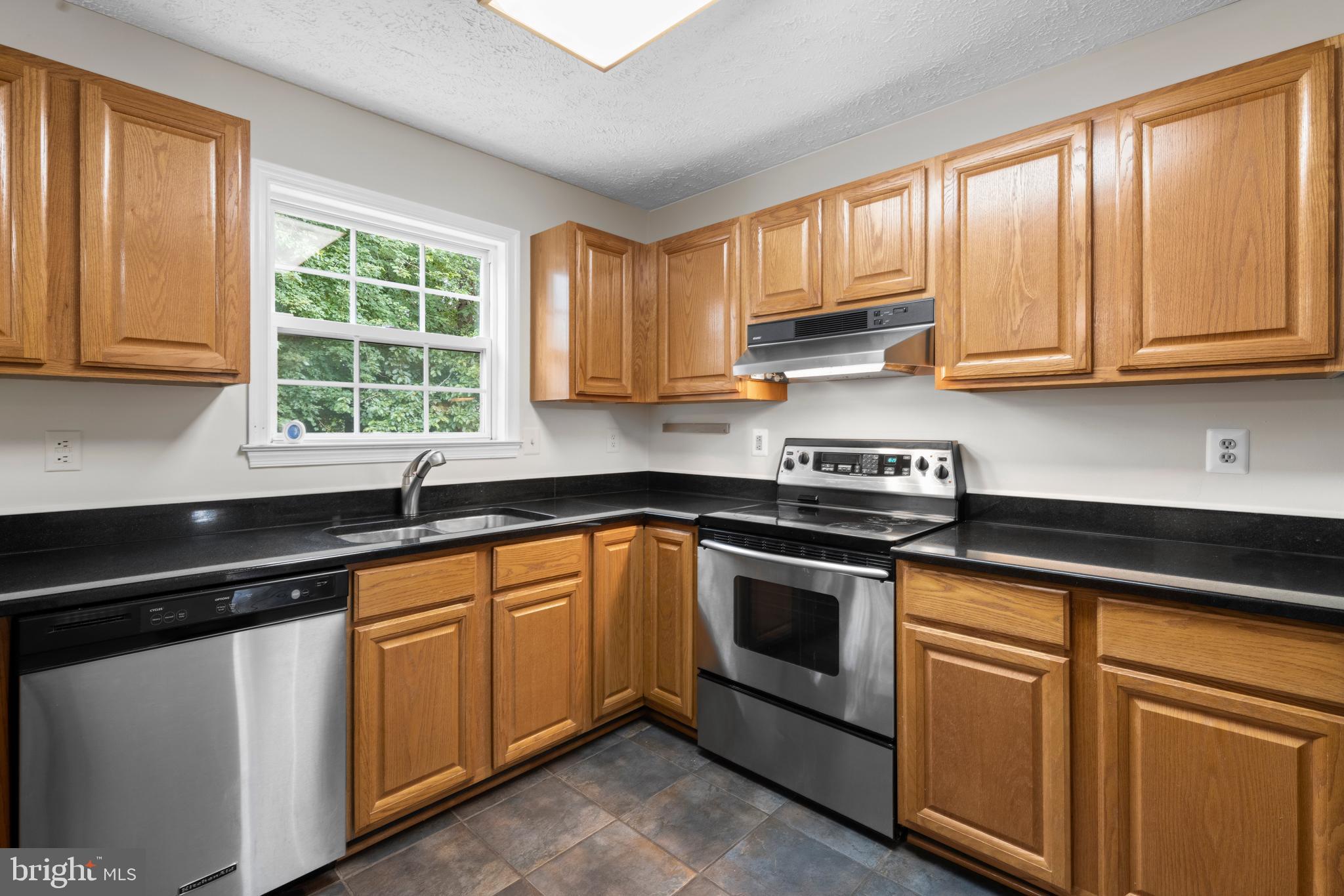107 Bragg Boulevard Odenton, MD 21113 - Photo 12 of 39 Stainless appliances & granite counters