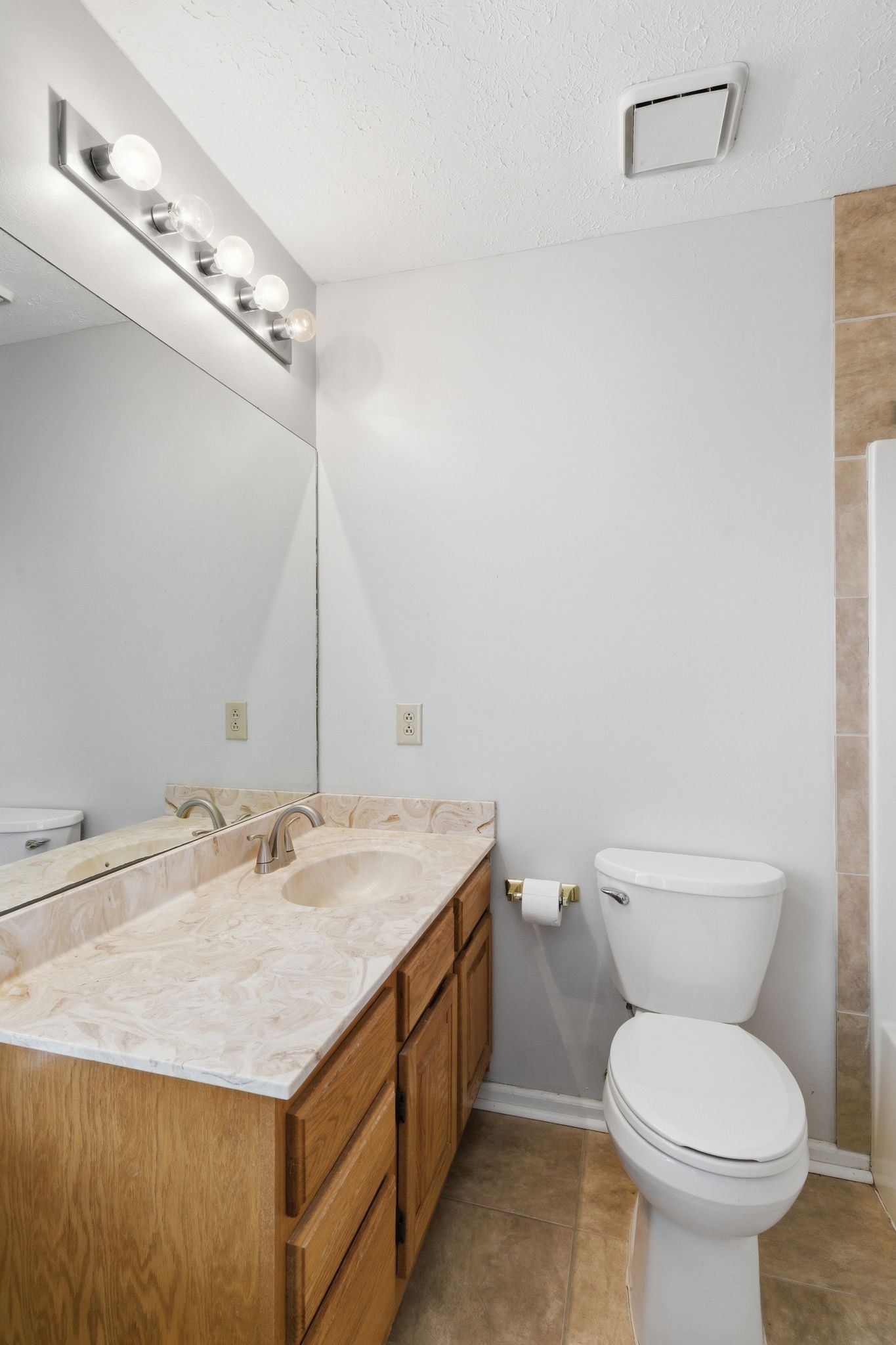 615 Vaughan's Gap Road Spring Hill, TN 37174 - Photo 18 of 26 a bathroom with a sink and a toilet