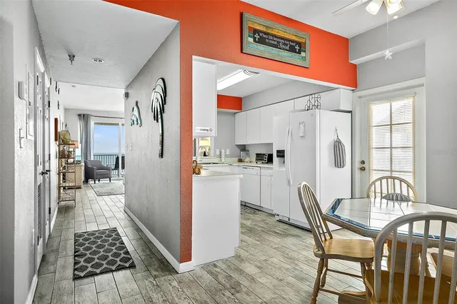 a kitchen with a table and chairs