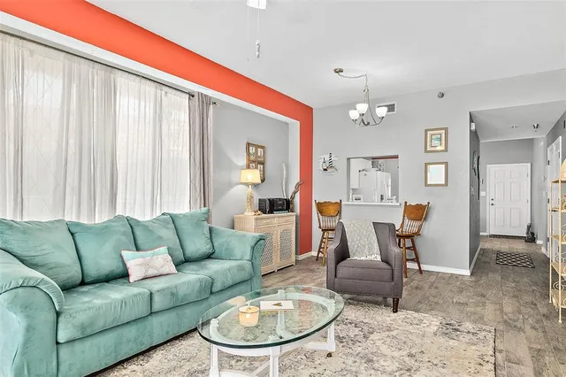 a living room with furniture and a table