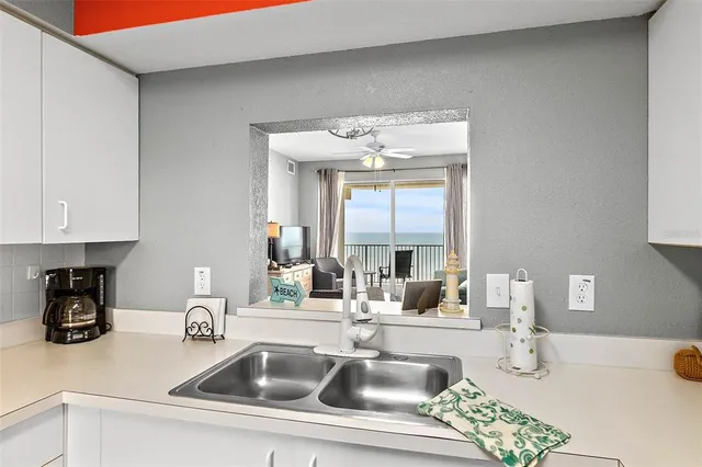 a kitchen with a sink and cabinets