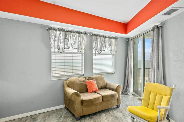 a living room with furniture and a window