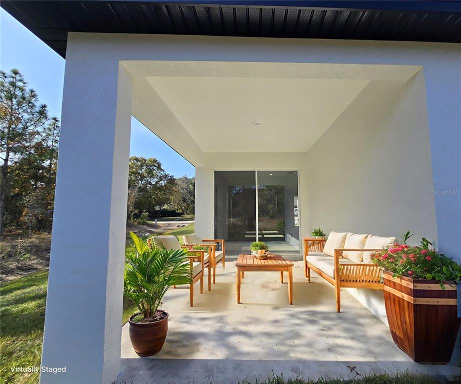 6 Calendula Court Homosassa, FL 34446 - Photo 15 of 67 a view of a chairs and table in the patio