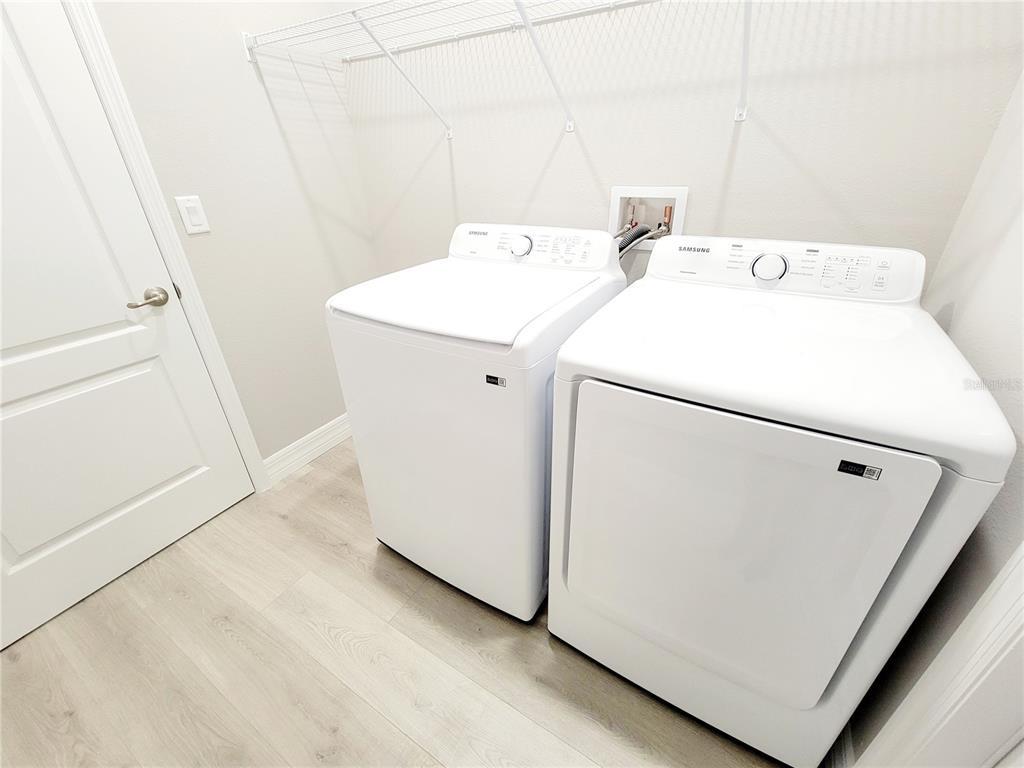 6 Calendula Court Homosassa, FL 34446 - Photo 21 of 67 a utility room with dryer and washer