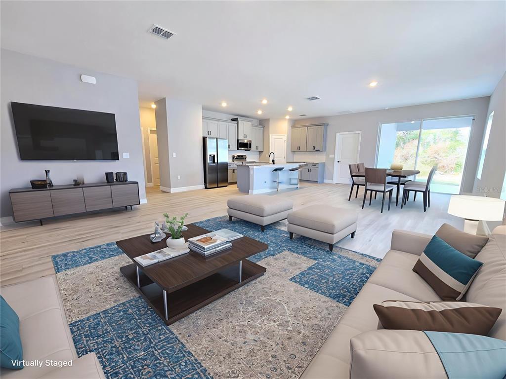 6 Calendula Court Homosassa, FL 34446 - Photo 3 of 67 a living room with furniture and a flat screen tv