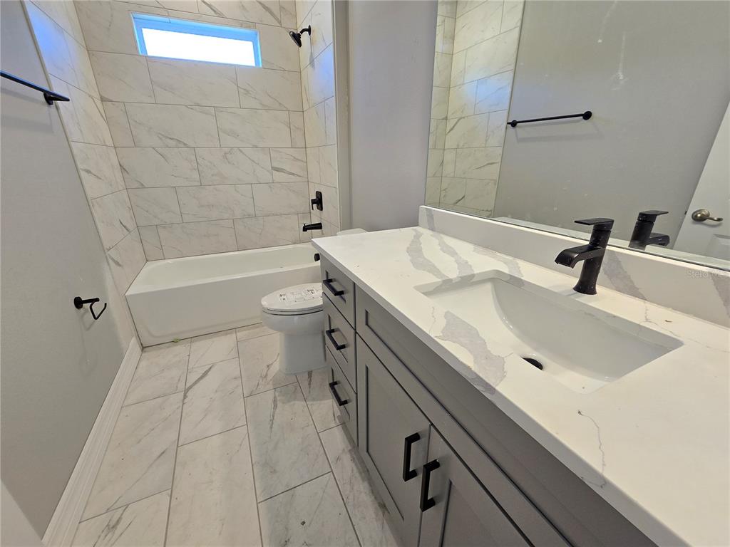 6 Calendula Court Homosassa, FL 34446 - Photo 36 of 67 a bathroom with a sink a toilet and bathtub