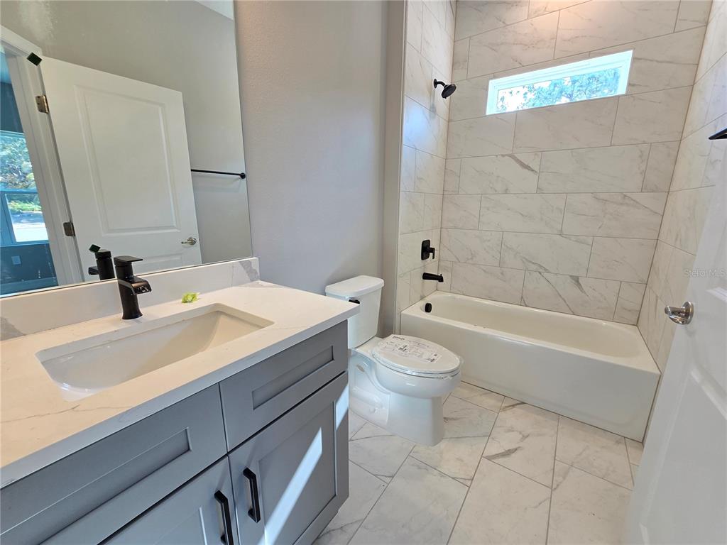 6 Calendula Court Homosassa, FL 34446 - Photo 37 of 67 a bathroom with a sink a toilet and a bathtub