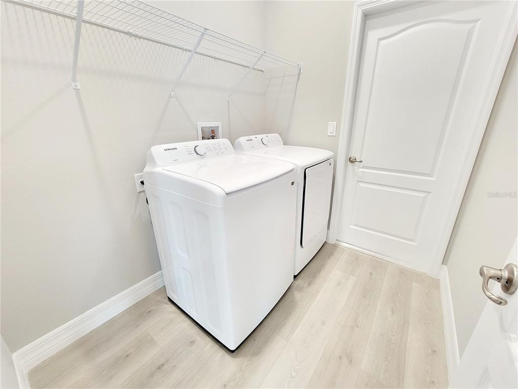 6 Calendula Court Homosassa, FL 34446 - Photo 60 of 67 a utility room with dryer and washer