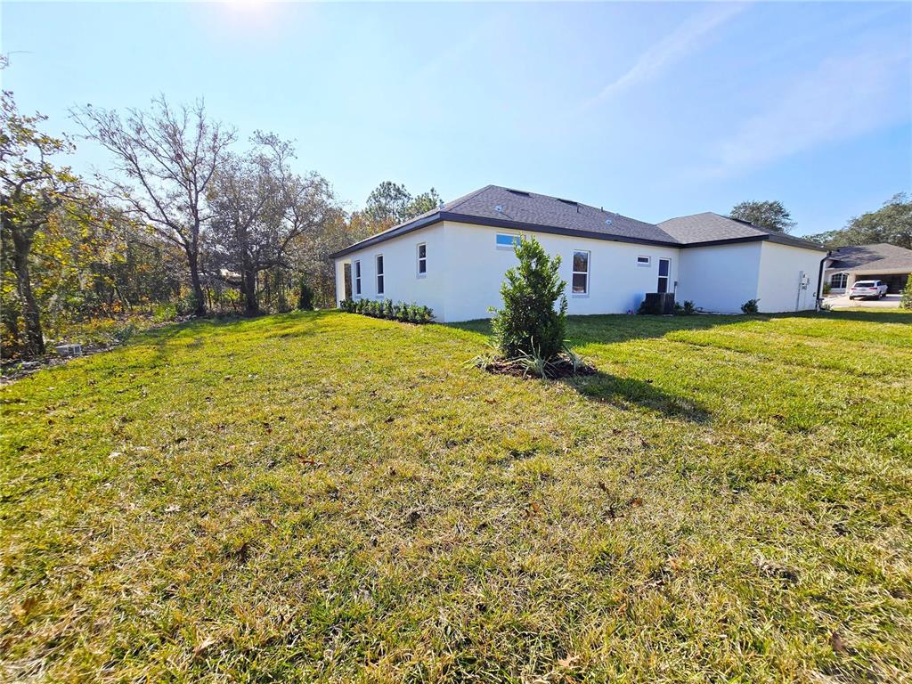 6 Calendula Court Homosassa, FL 34446 - Photo 66 of 67 a view of a house with a yard