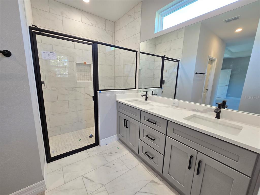 6 Calendula Court Homosassa, FL 34446 - Photo 9 of 67 a bathroom with a double vanity sink and mirror