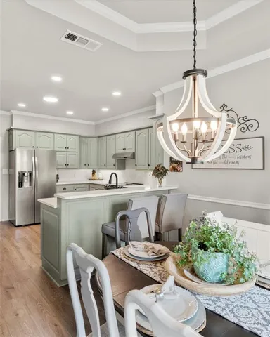 a kitchen with a table and chairs in it
