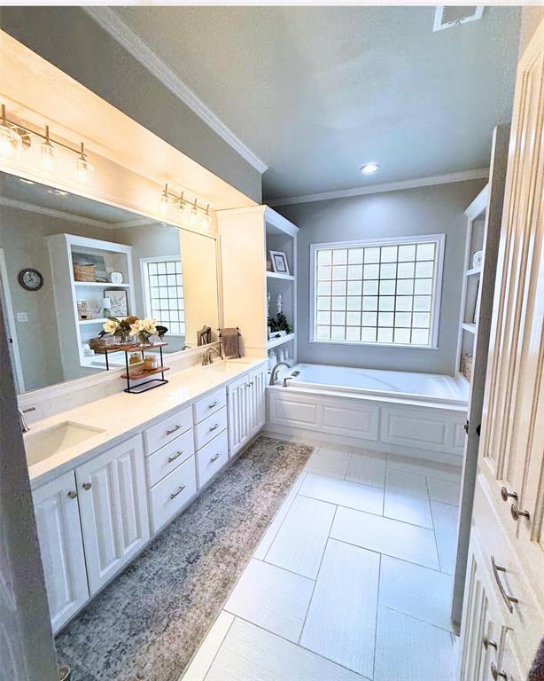 3006 Master Dr Mount Mount Pleasant, TX 75455 - Photo 20 of 34 a large bathroom with a large tub and sink
