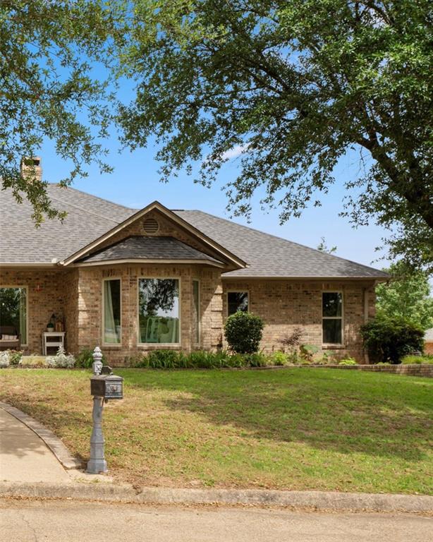 3006 Master Dr Mount Mount Pleasant, TX 75455 - Photo 2 of 34 a front view of a house with garden