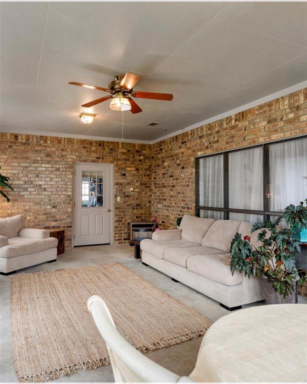3006 Master Dr Mount Mount Pleasant, TX 75455 - Photo 23 of 34 a living room with furniture and a fireplace
