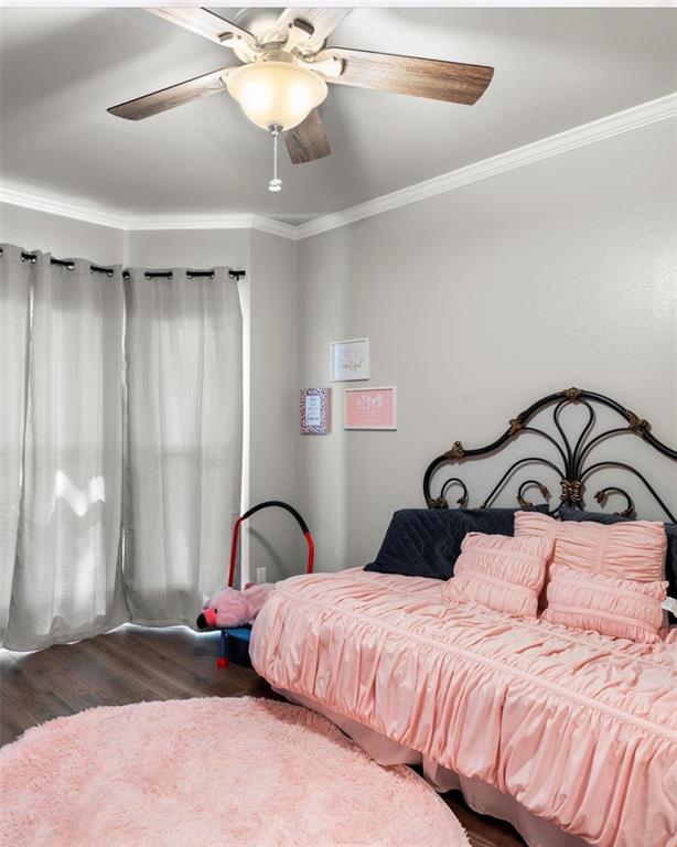 3006 Master Dr Mount Mount Pleasant, TX 75455 - Photo 24 of 34 a bedroom with a bed and a ceiling fan