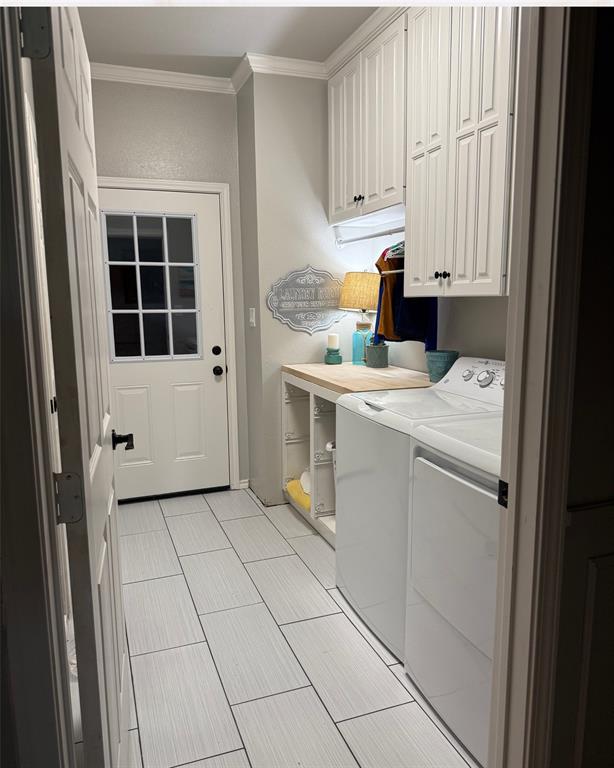 3006 Master Dr Mount Mount Pleasant, TX 75455 - Photo 26 of 34 a utility room with cabinets washer and dryer