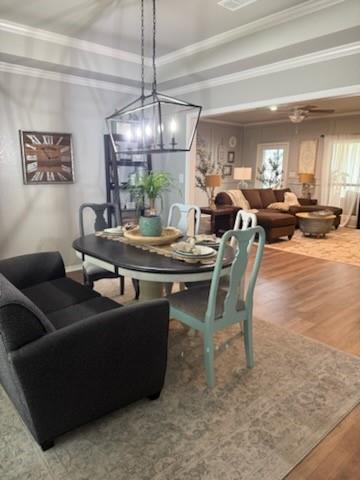 3006 Master Dr Mount Mount Pleasant, TX 75455 - Photo 29 of 34 a dining room with furniture a chandelier and a large window