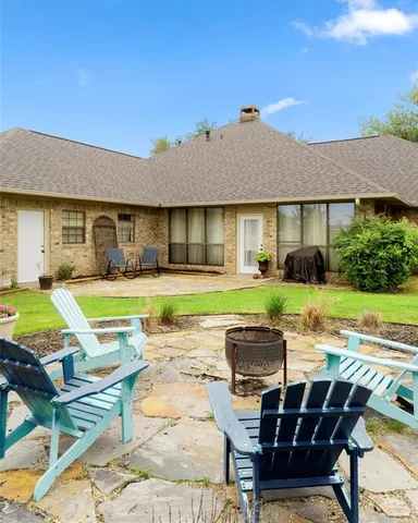 a view of a house with swimming pool and porch