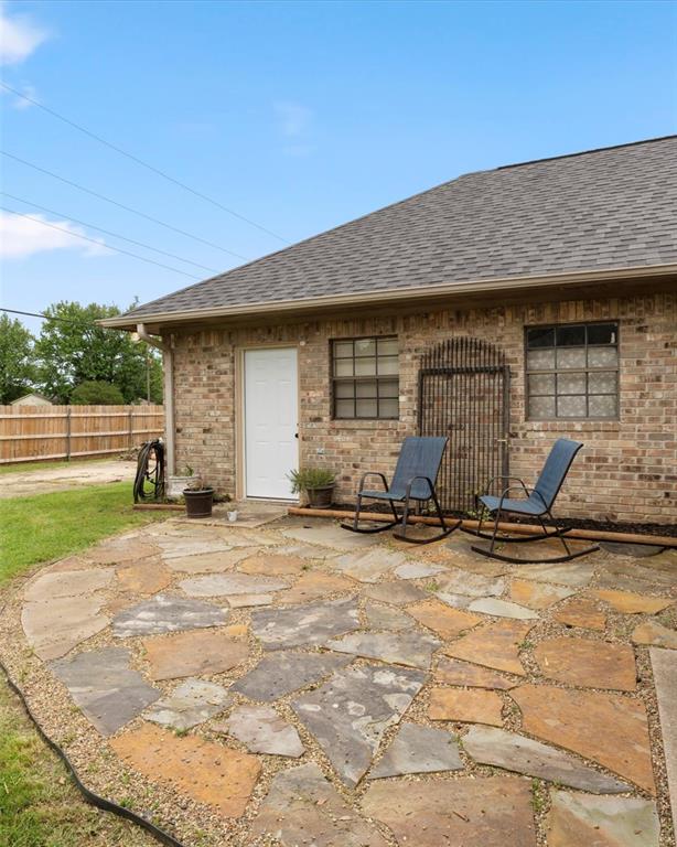 3006 Master Dr Mount Mount Pleasant, TX 75455 - Photo 5 of 34 a backyard of a house with seating space