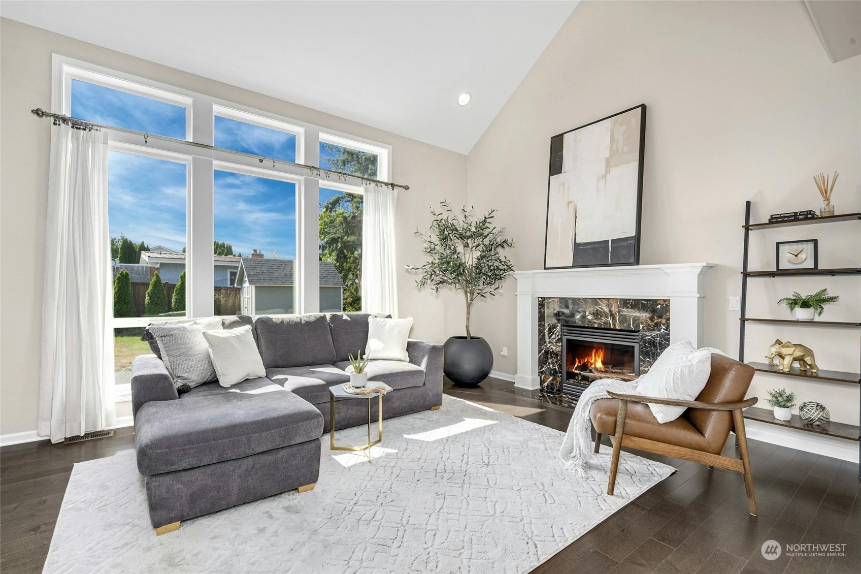 2425 Northeast 20th Street Renton, WA 98056 - Photo 19 of 39 a living room with furniture and a fireplace