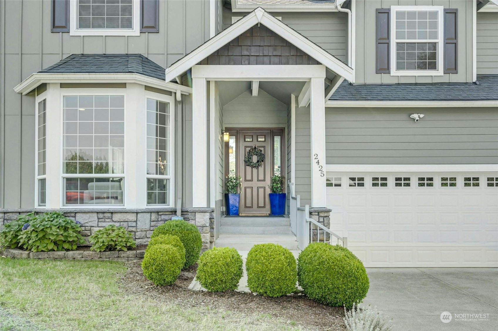 2425 Northeast 20th Street Renton, WA 98056 - Photo 3 of 39 a front view of a house with garden