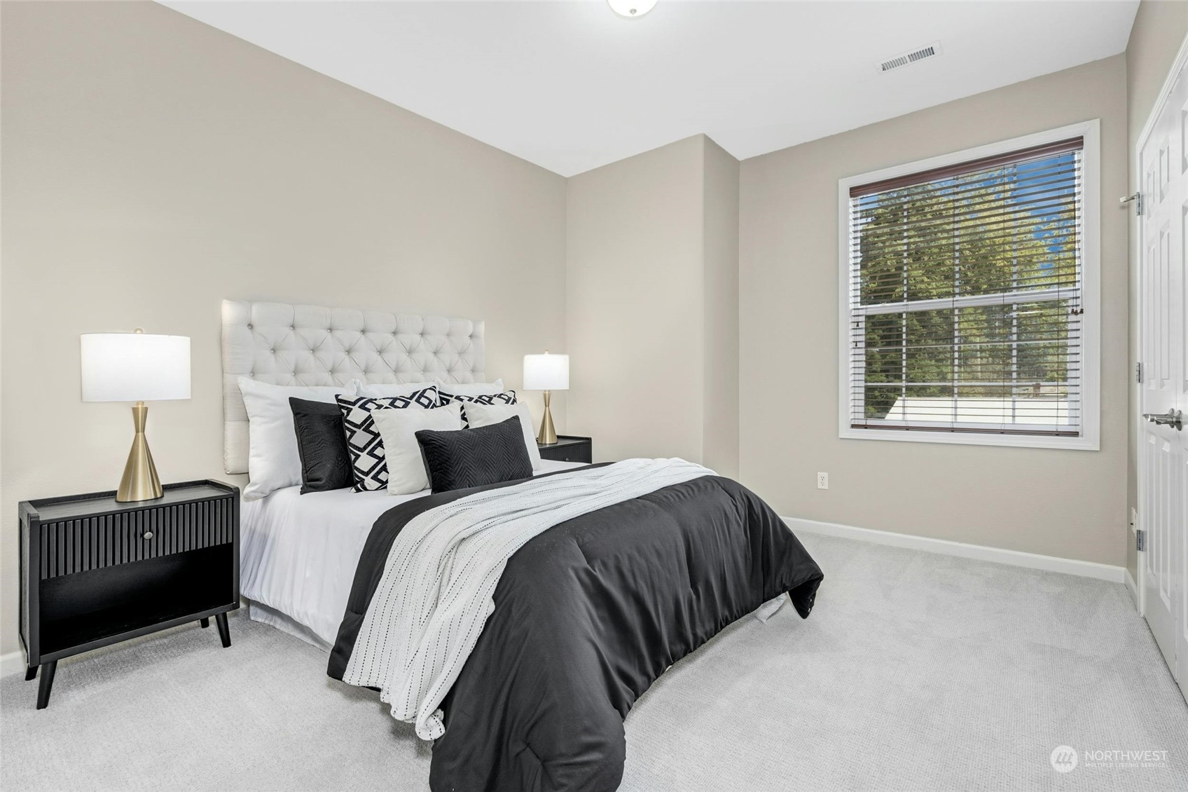 2425 Northeast 20th Street Renton, WA 98056 - Photo 33 of 39 a bedroom with a bed and a window