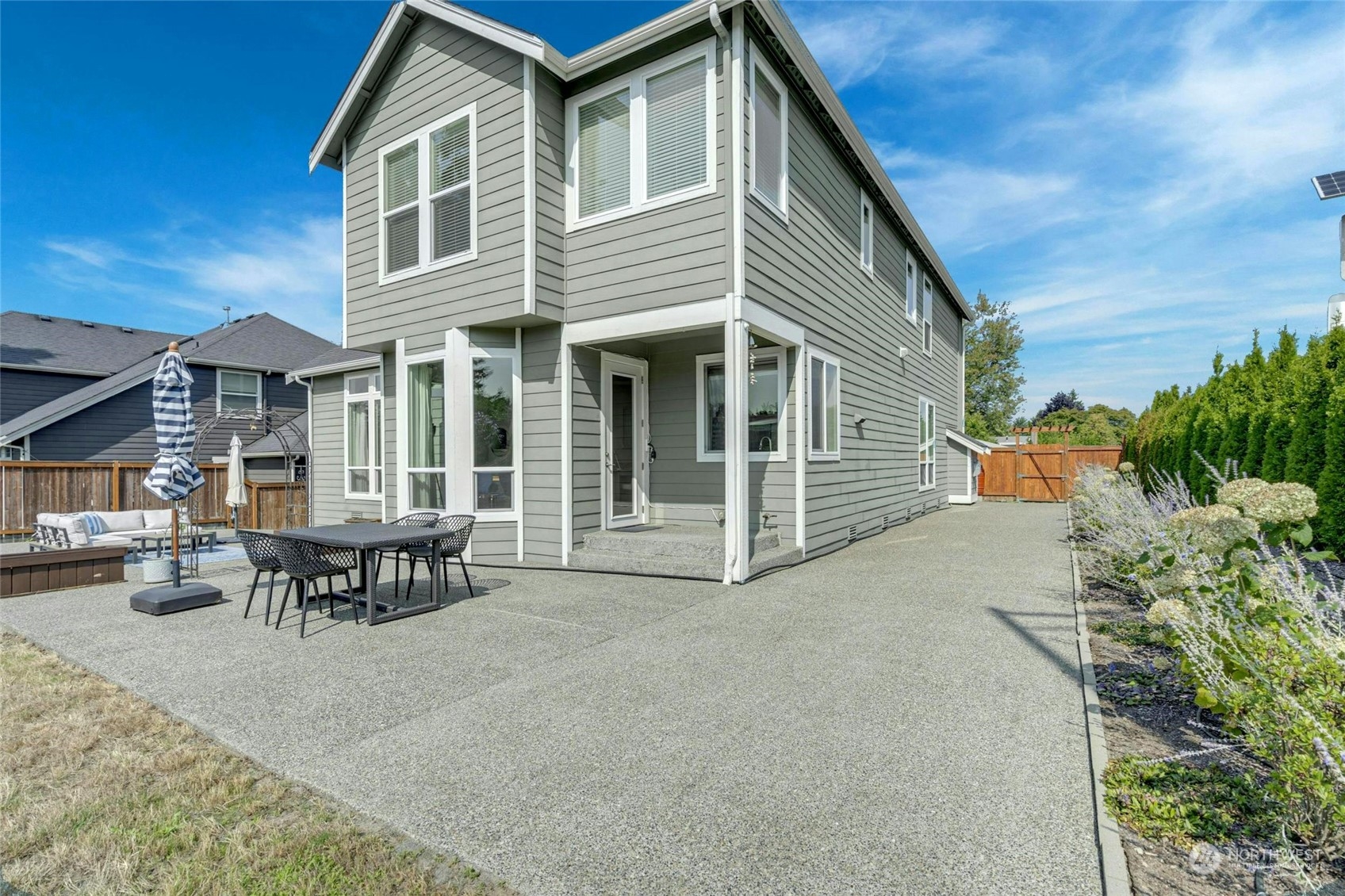 2425 Northeast 20th Street Renton, WA 98056 - Photo 39 of 39 a backyard of a house with barbeque oven table and chairs