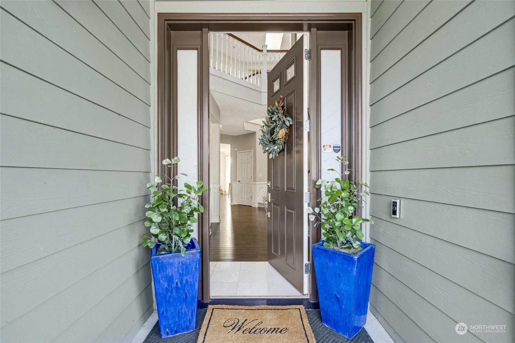 2425 Northeast 20th Street Renton, WA 98056 - Photo 4 of 39 a view of a potted plants in front of a glass door