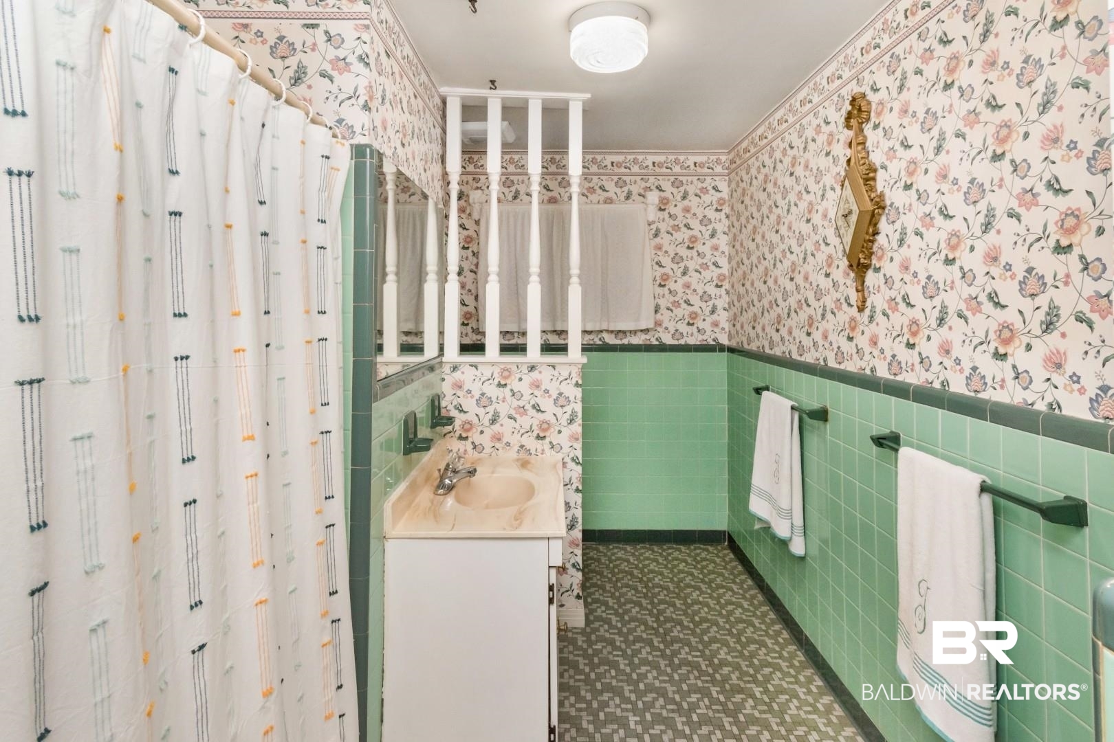 6300 Woodcrest Drive Mobile, AL 36608 - Photo 19 of 35 Bathroom featuring vanity, wallpapered walls, a shower stall, wainscoting, and tile walls